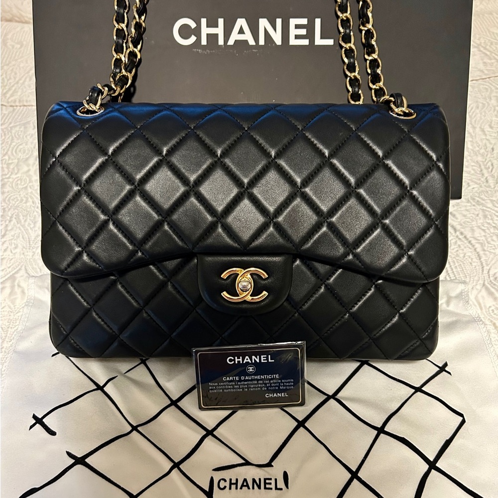 Black Classic 11.12 Chanel Hand bag with authenticity card and original box.
